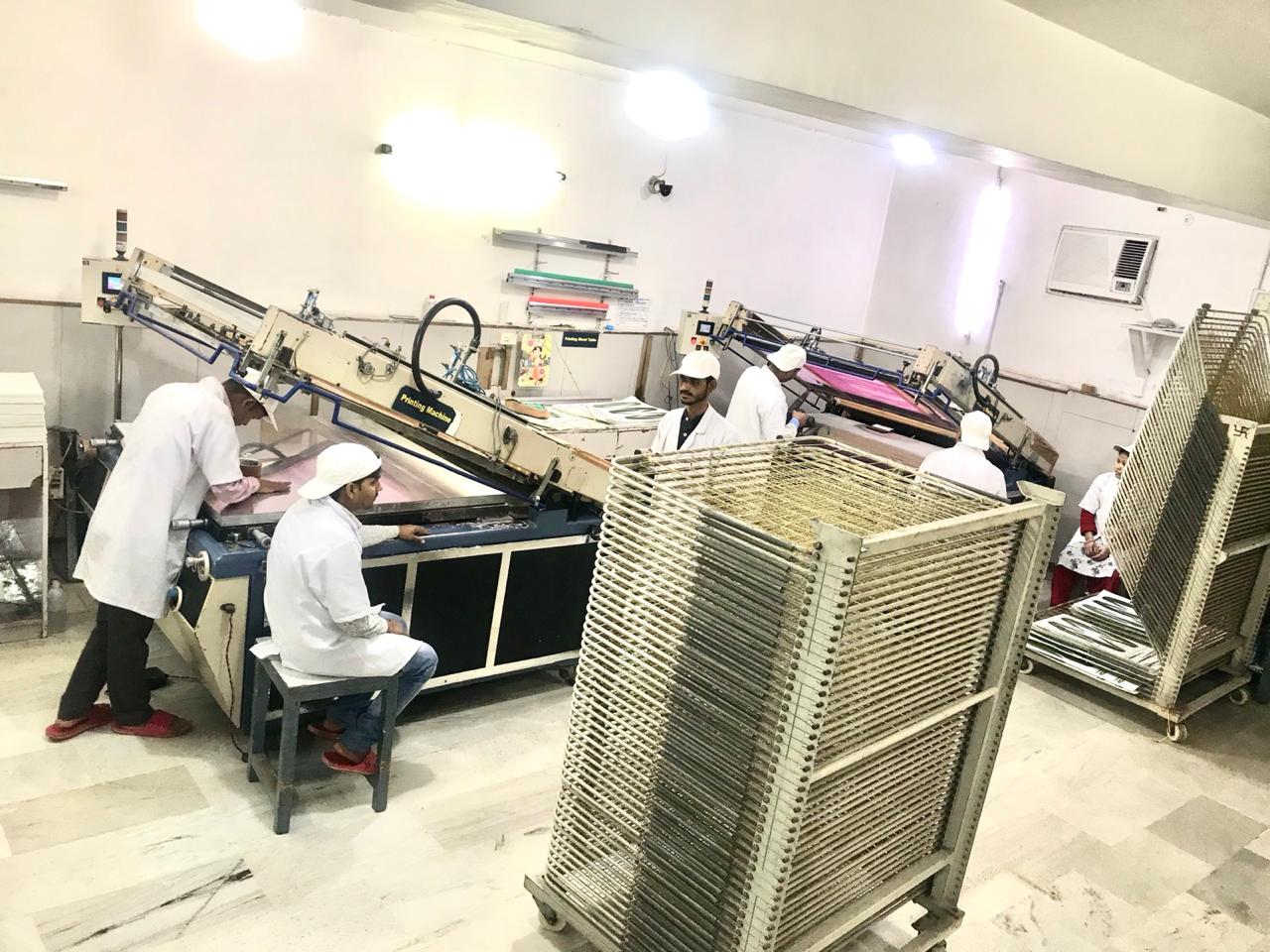 Screen printing hall with automatic presses and drying racks at Unit 1, Narela